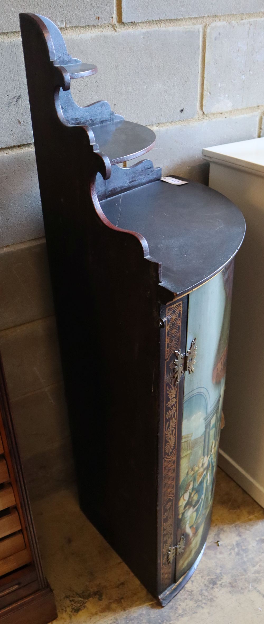 A Dutch painted and gilded hanging corner cupboard, circa 1800, width 57cm, depth 42cm, height 140cm